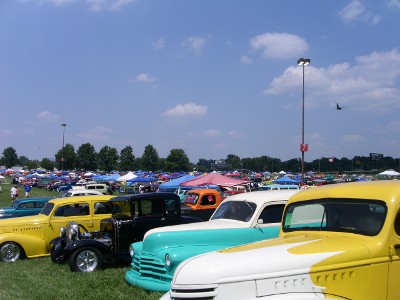 [Colorful cars and tents as far as the eye can see.]